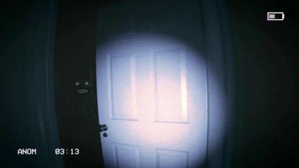 Looking through the ajar door at the monster with the weeping angel mechanic