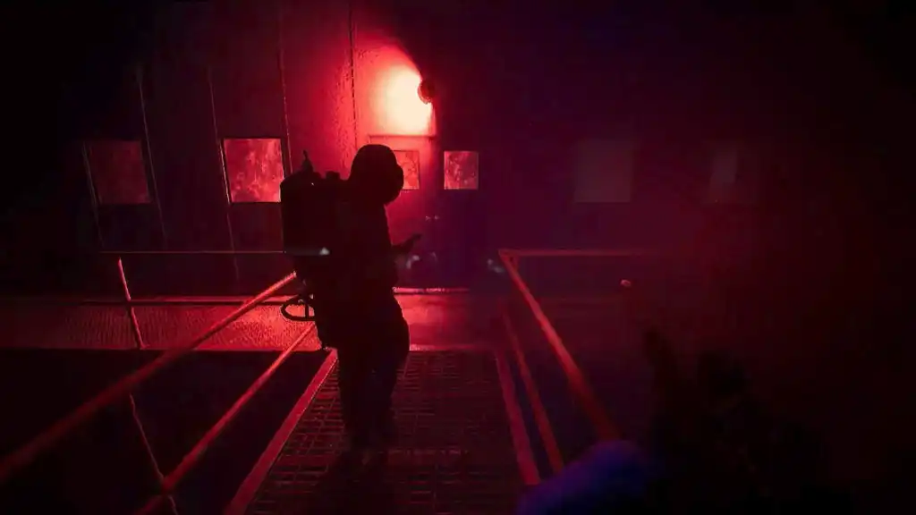Following a polar expedition research holding a flamethrower, approaching a door with a red alarm above it