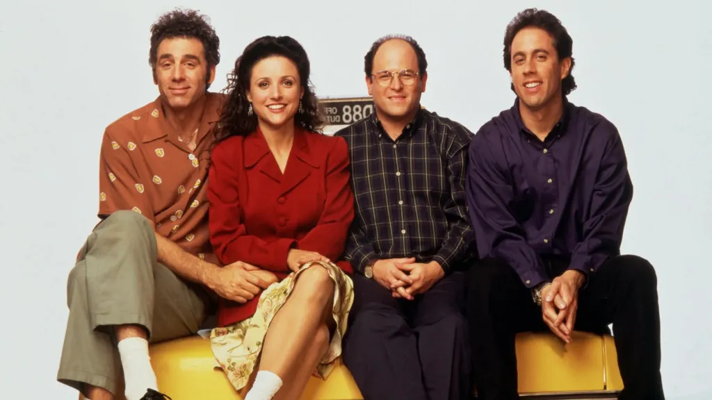 Seinfeld cast sitting on a cab