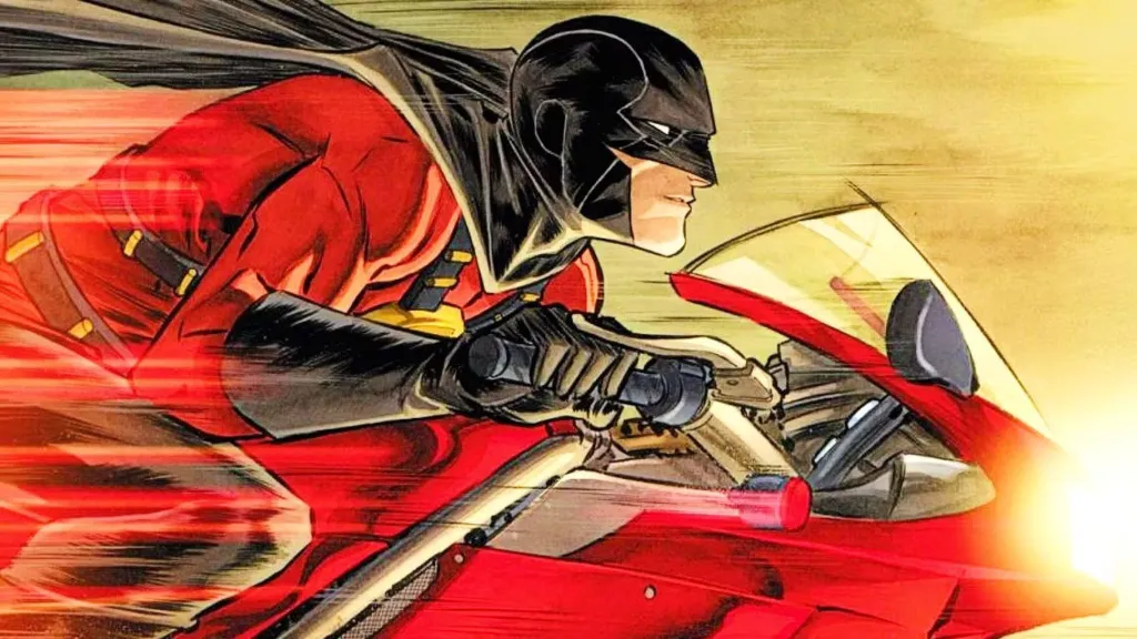 Red Robin riding a bike in DC Comics.