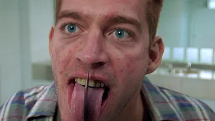 Harry Connick Jr licking a knife in Copycat