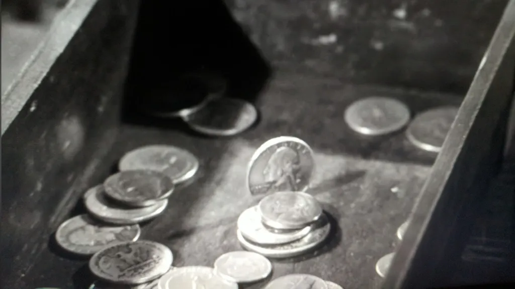 A quarter standing on its side in "A Penny For Your Thoughts"