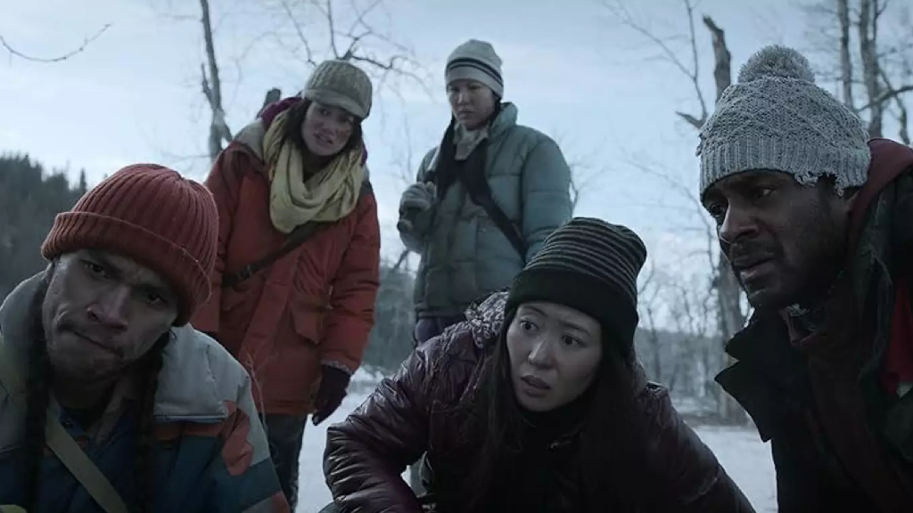 Five characters stood together in a still from Black Summer