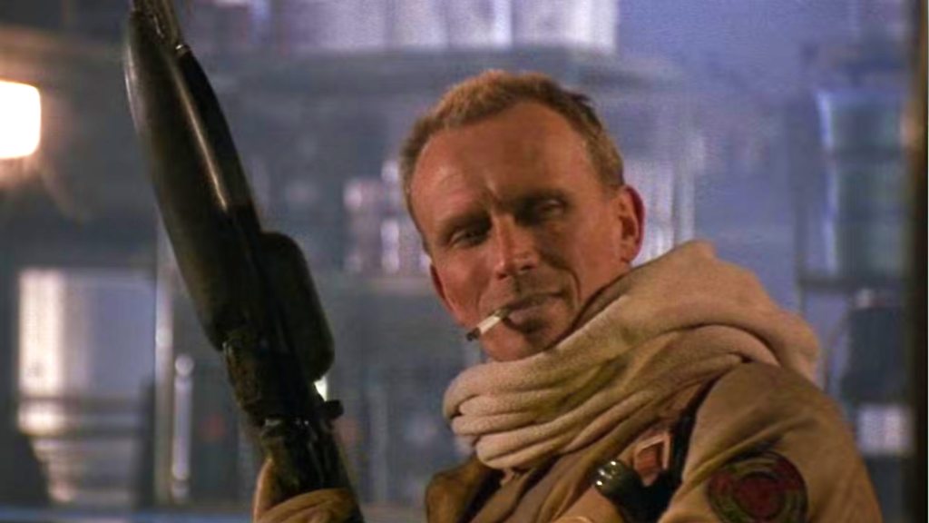 Peter Weller holding a gun in Screamers (1995)