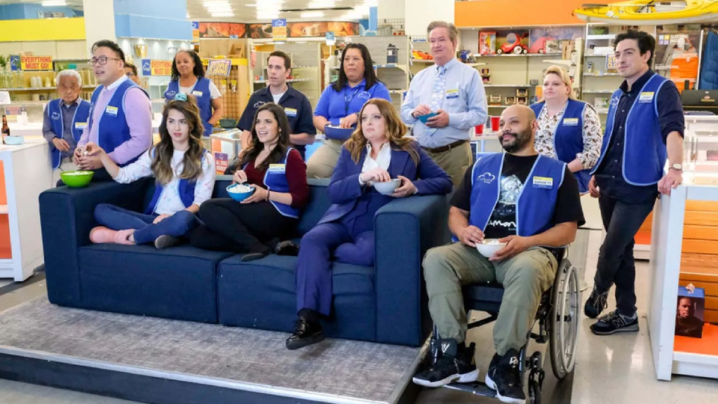 The cast of Superstore watching TV in the finale