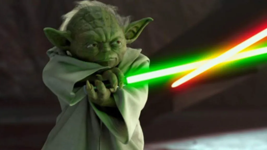 Yoda with his green lightsaber