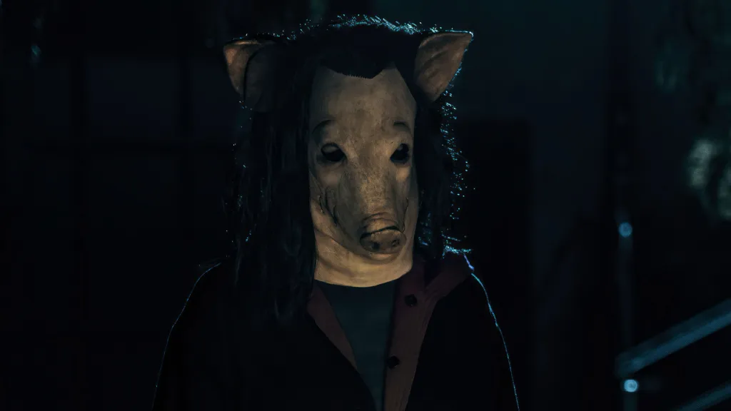 Shawnee Smith as Amanda Young (wearing a pig mask) in Saw X