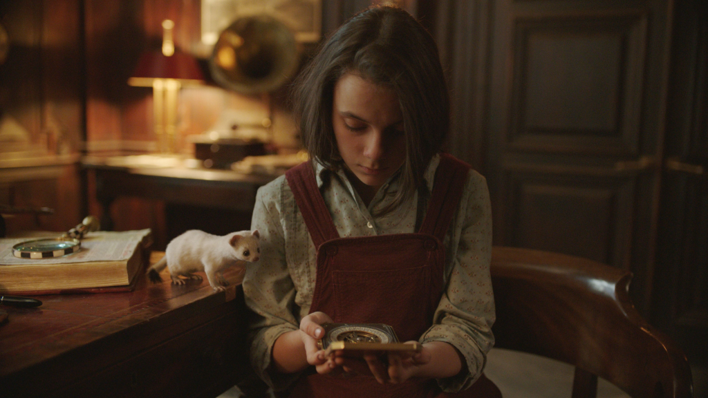 Lyra (Dafne Keen) and Pan in His Dark Materials