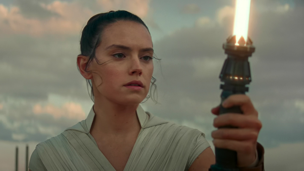 Rey with her yellow lightsaber in Star Wars The Rise of Skywalker