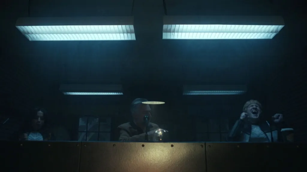 Guy Gardner showing his gold tooth next to the Justice Gang in Peacemaker.