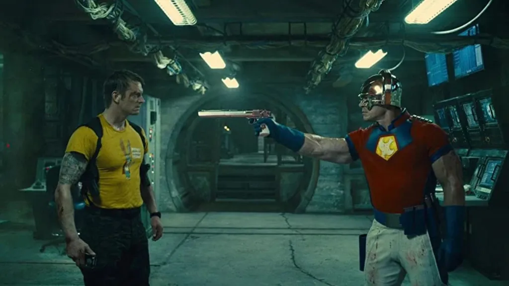 Peacemaker pointing a gun at Rick Flag in The Suicide Squad.