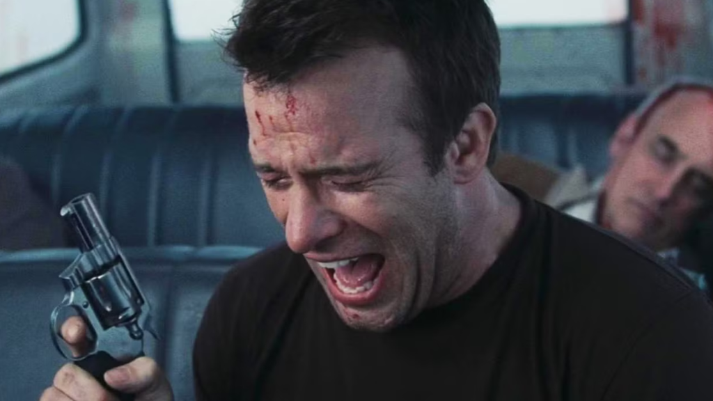Thomas Jane crying and holding a gun at the end of the The Mist (2007)