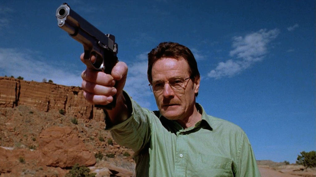 Bryan Cranston as Walter White aiming a gun in the pilot episode of Breaking Bad