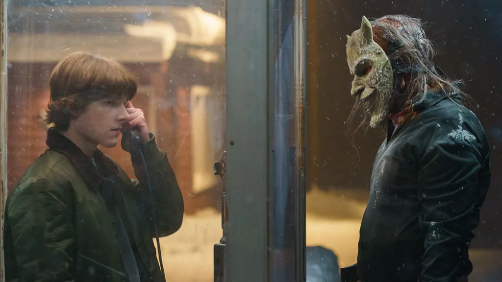 Ethan Harwke as the Grabber and Mason Thames as Finney in The Black Phone 2