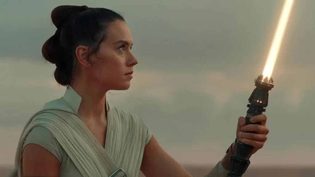 Rey with yellow lightsaber in Star Wars The Rise of Skywalker