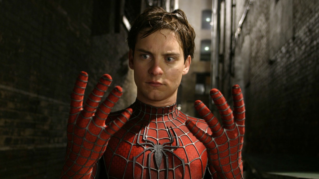 Tobey Maguire as Peter Parker looking at his hands in Spider-Man 2 (2004)