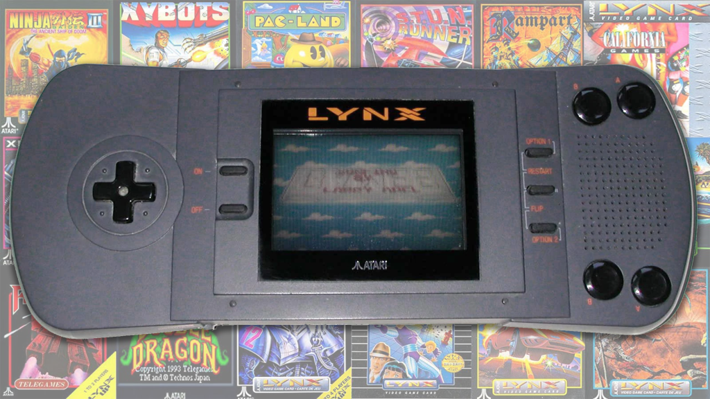 The Atari Lynx over a collection of box art from its game library.