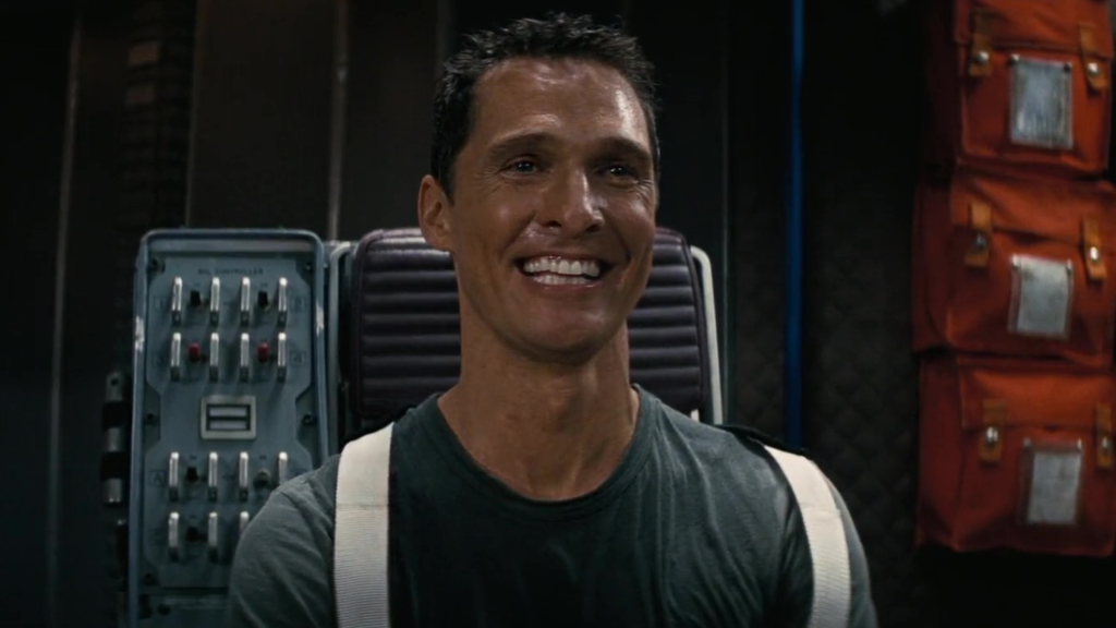 Coop (Matthew McConaughey) watching home videos in Interstellar