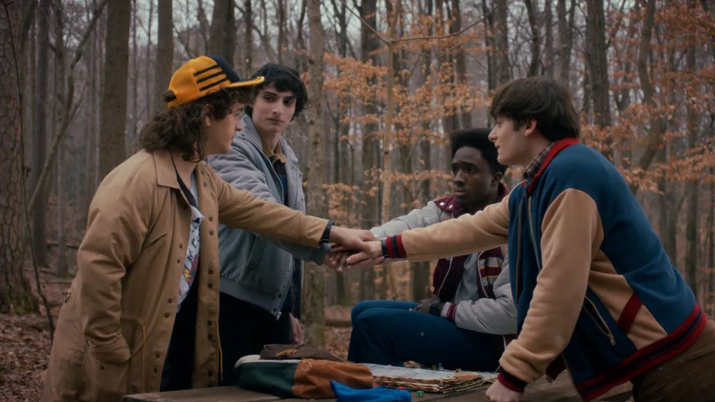 Gaten Matarazzo as Dustin Henderson, Finn Wolfhard as Mike Wheeler, Caleb McLaughlin as Lucas Sinclair, and Noah Schnapp as Will Byers in STRANGER THINGS SEASON 5