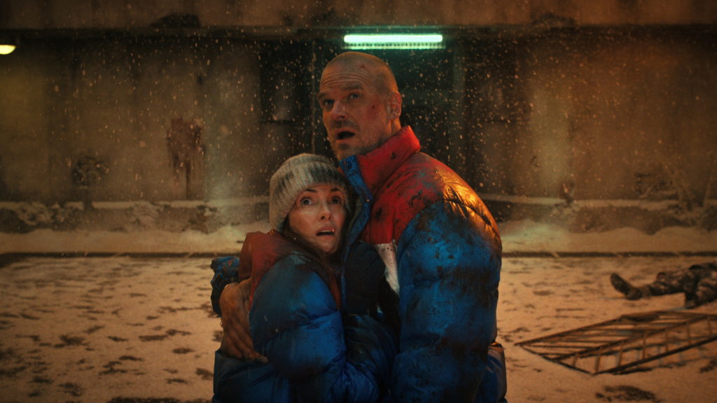 Joyce and Hopper hugging and looking up in Stranger Things Season 4