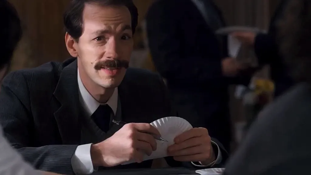 Mr. Clarke holding a paper plate in Stranger Things Season 1