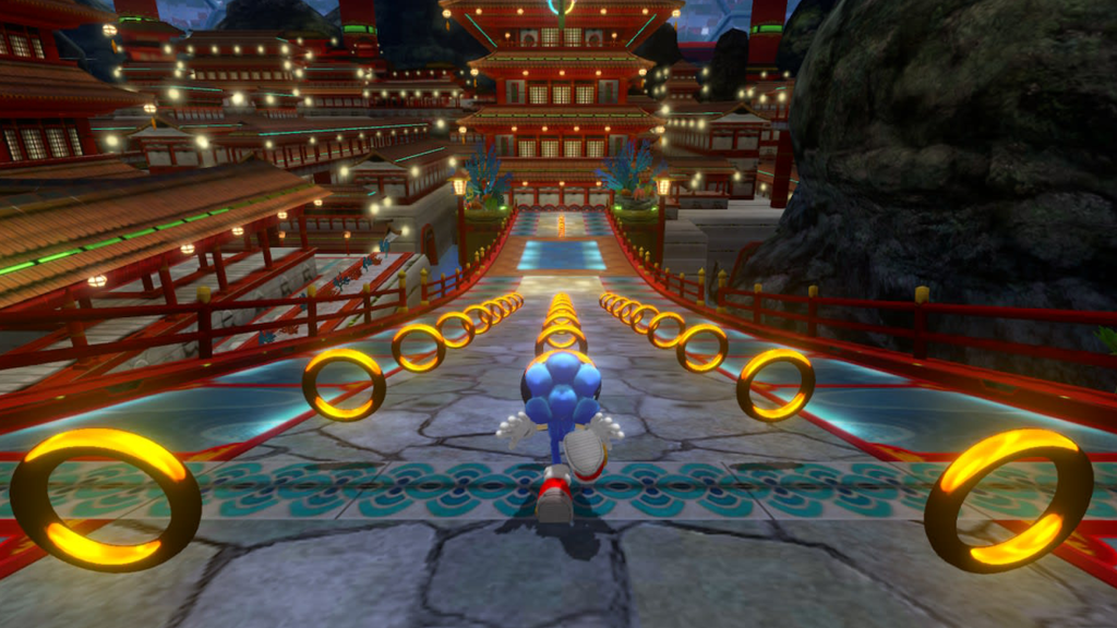 A screenshot from Sonic Colors, showing Sonic running down a track surrounded by rings.