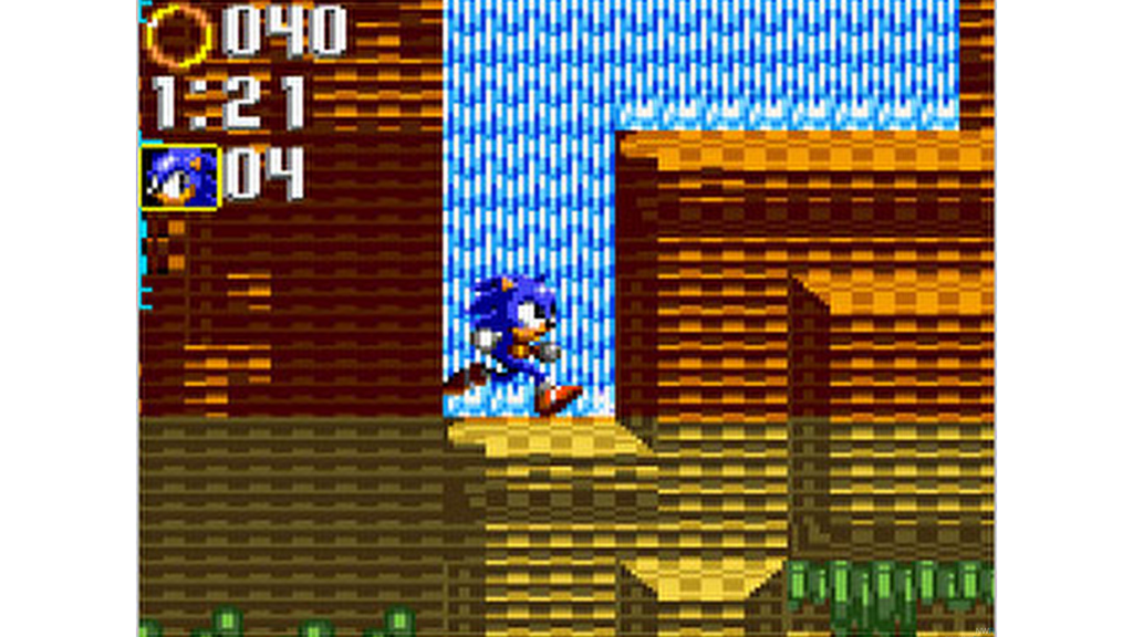 A screenshot from Sonic Triple Trouble, showing Sonic running by a waterfall.
