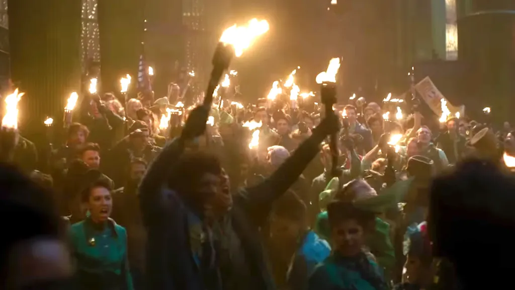 People marching with torches in Wicked: For Good