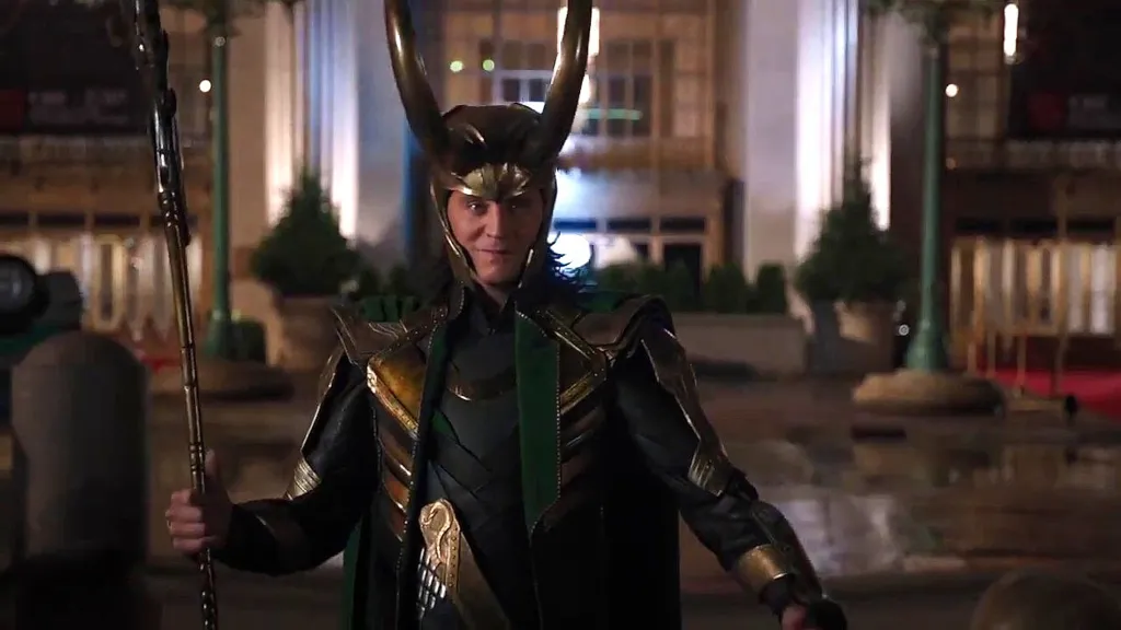 Tom Hiddleston smiling with his helmet in The Avengers