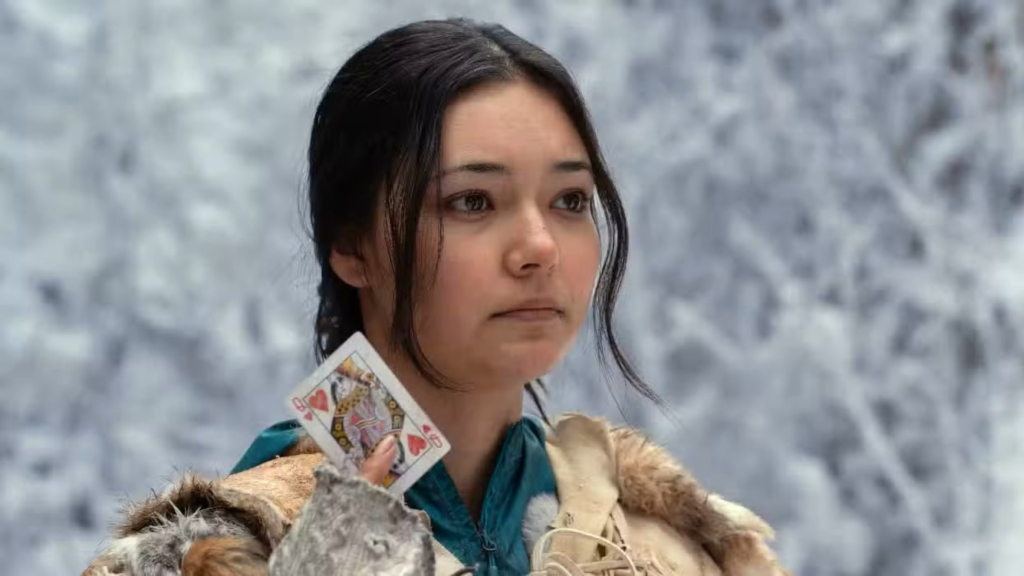 Mari holding up the queen card in Yellowjackets Season 3