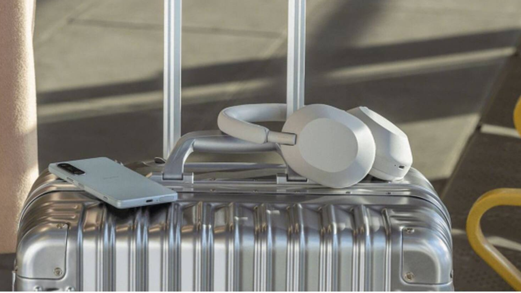 Silver Sony WH-1000XM5 on Suitcase