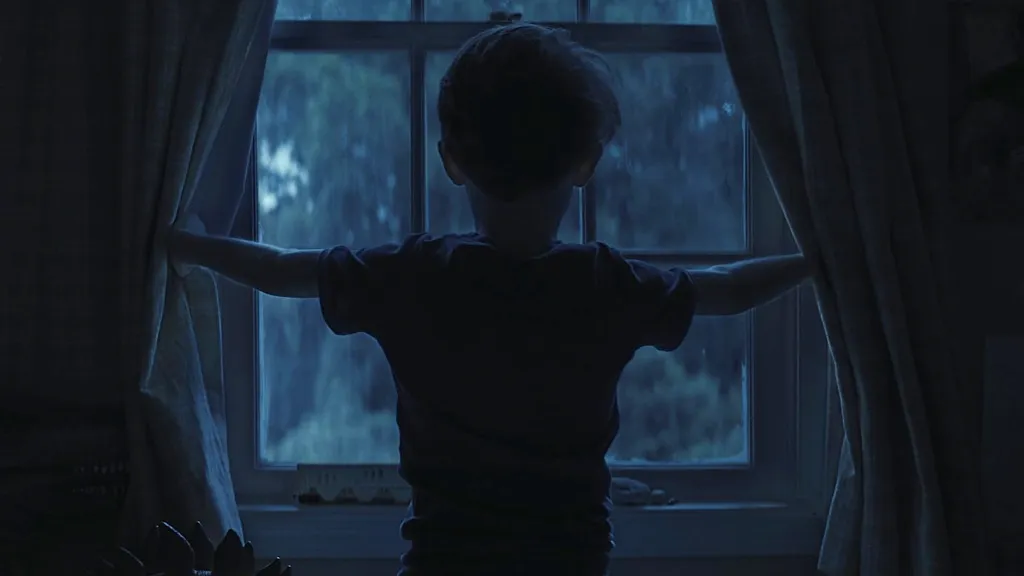 Kid looking out window in Weapons