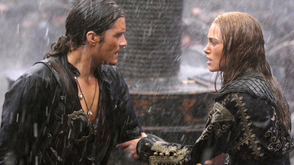 Will and Elizabeth holding onto each other in the rain in Pirates of the Caribbean