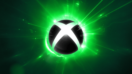 The Xbox logo with green flare effects behind it.