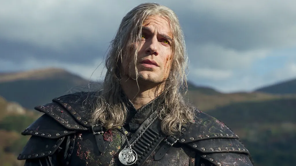Henry Cavill frowning and looking disheveled as Geralt in The Witcher