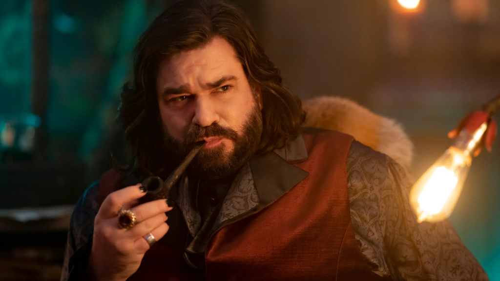 Matt Berry smoking a pipe in What We Do in the Shadows