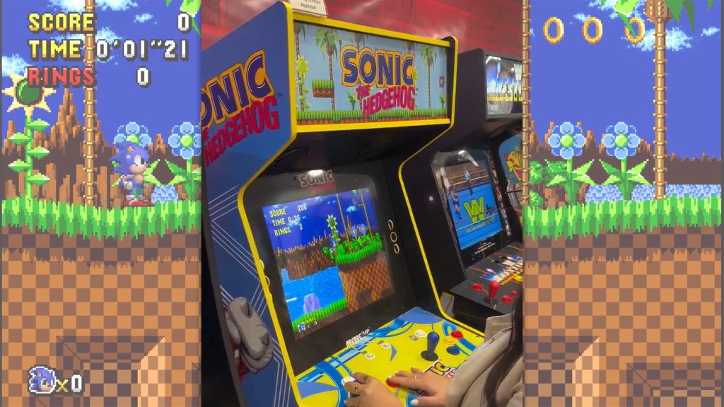 The Sonic the Hedgehog arcade game over a screenshot from the game.