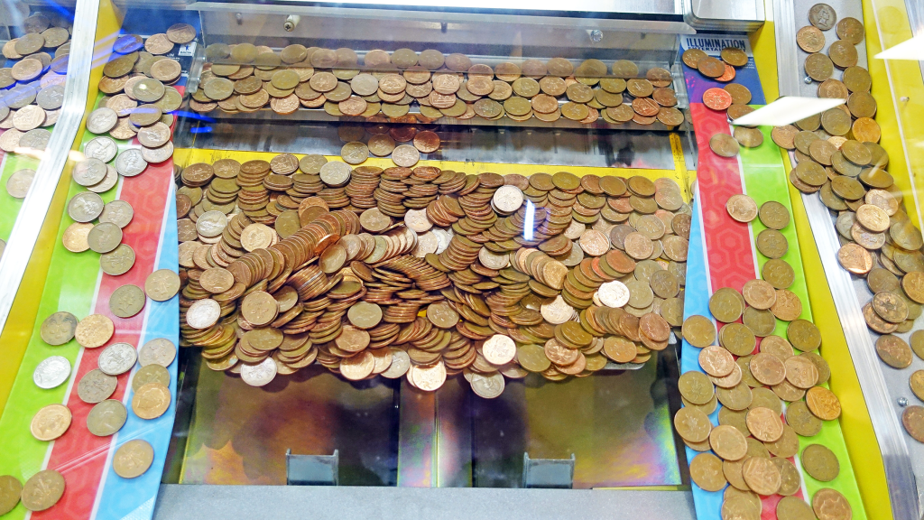 A coin pusher arcade redemption machine.