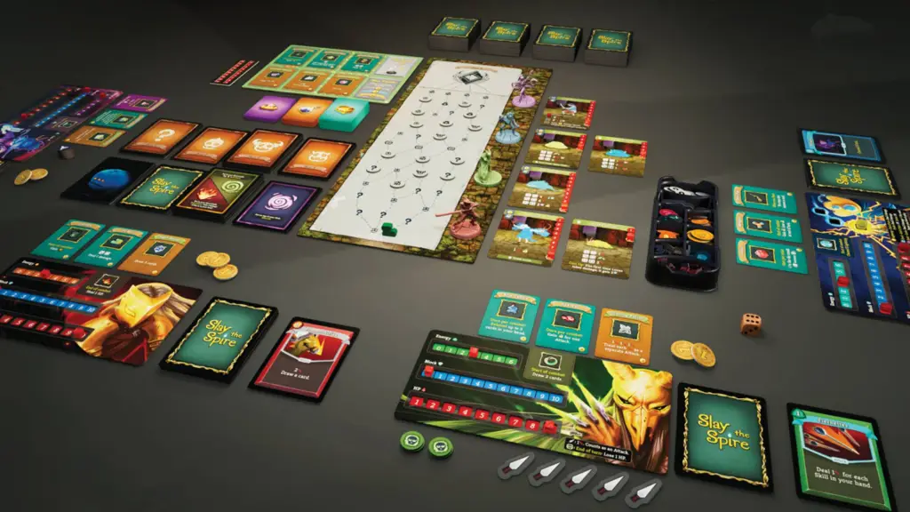 The Slay the Spire board game components laid out.
