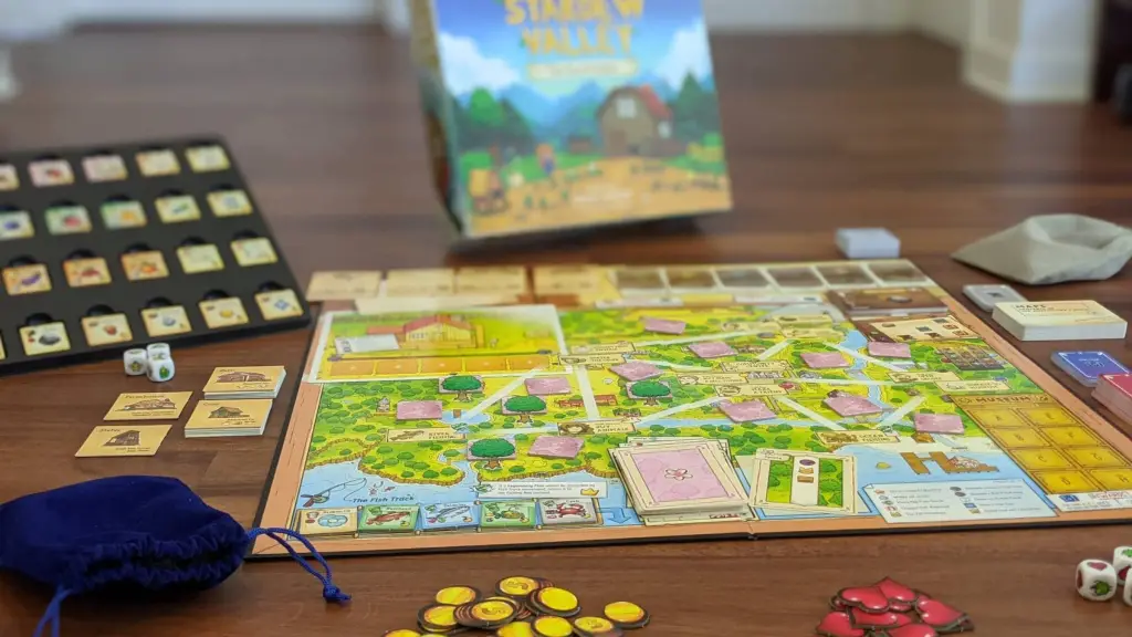 The Stardew Valley board game surrounded by pieces.